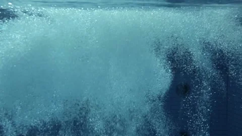 Underwater POV with bubbles in deep olympic swimming pool Stock Footage 135086313