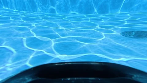 Underwater POV of Robotic Pool Cleaner Cleaning Swimming Pool Stock Footage 345513743