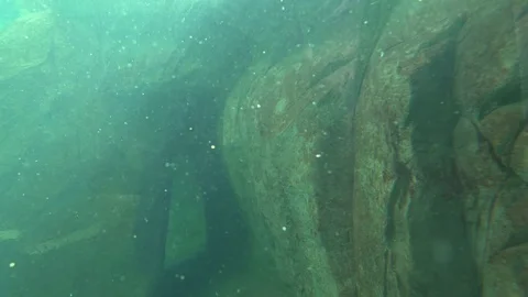 Underwater rocks lightrays particles Stock Footage 73996616