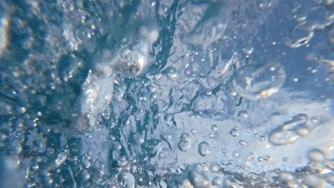 Underwater sea bubbles rising through breaking wave interior Stock Footage 342160565
