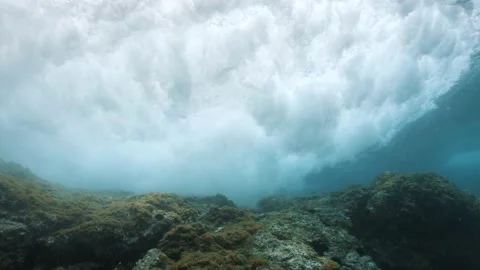 Underwater sea wave breaking below water surface Stock Footage 137779862
