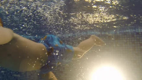 An underwater shot of diving toddler Stock Footage 116897771