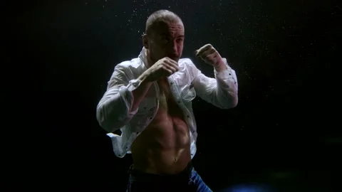 Underwater shot of fighting man inside dark deepness, man is boxing inside water Stock Footage 168130826