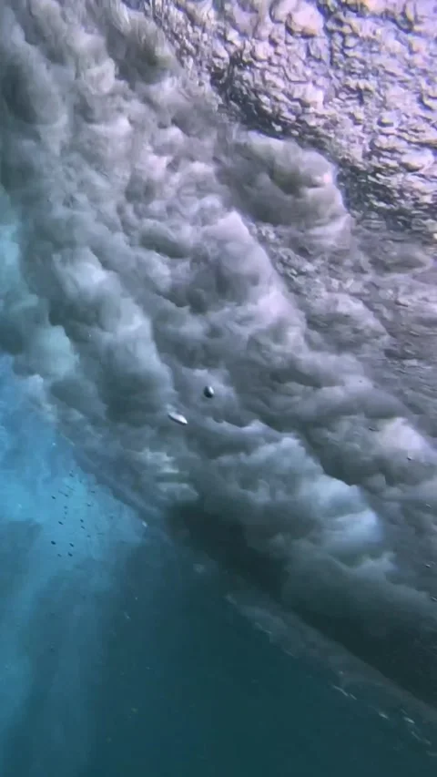 Underwater shot of ocean wave.slow motion.Vertical video Stock Footage 296203894