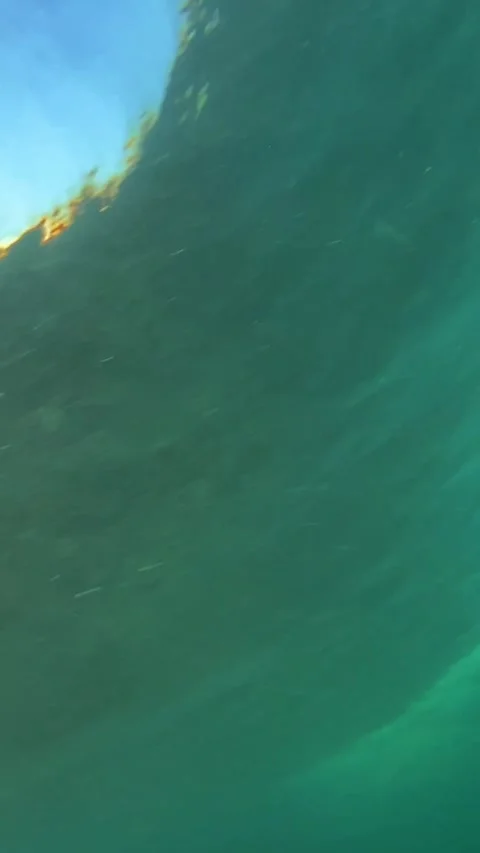 Underwater shot of ocean wave.slow motion.Vertical video Stock Footage 296203919