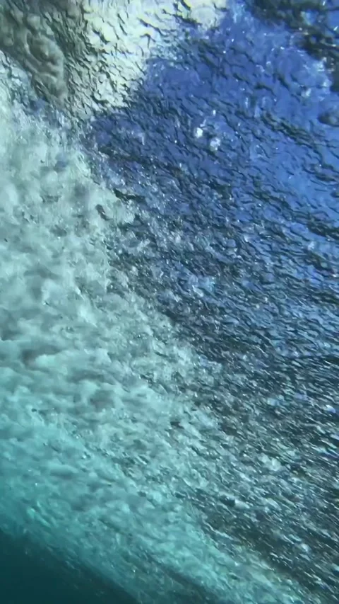Underwater shot of ocean wave.slow motion.Vertical video Stock Footage 296203939