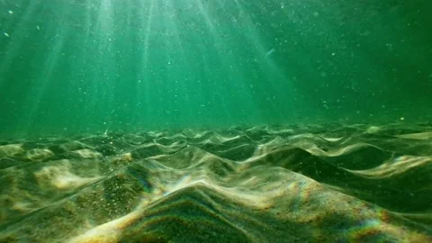 Underwater shot, sand and rays of light. Stock Footage 214374066