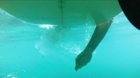 Underwater shots of a Man with his surfboard in the blue ocean Stock Footage 67983756
