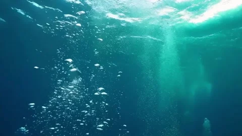 Underwater slow motion bubbles moving to surface 1 Stock Footage 285234508