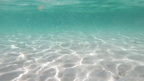 Underwater slow motion view of caustics on a sandy seabed Stock Footage 337717110