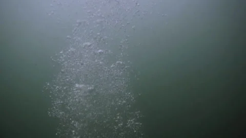 Underwater slowmotion view of a diver in a old diving suit Stock Footage 148590815