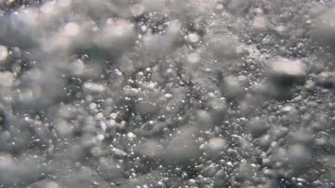 Underwater stream of air bubbles moves through seawater in soft flowing natural Stock Footage 335940093
