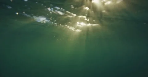 Underwater Surface With Rays of Light. Stock Footage