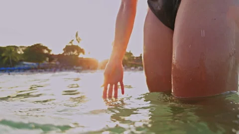 Underwater To Surface Transition With Sunlight And Bubbles Around Woman Legs As Stock Footage 333318118