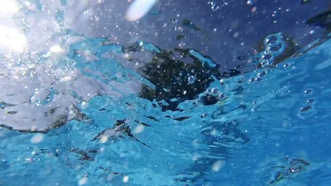 Underwater video of friends have party bathing and swimming in private holiday Stock Footage 130182653
