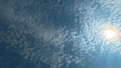 Underwater view of blue sky and clouds through gently rippling water surface Stock Footage 342047006