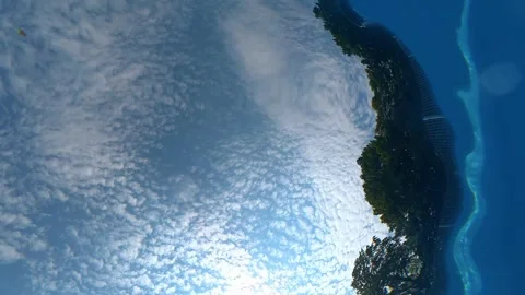 Underwater view of blue sky and clouds through gently rippling water surface Stock Footage 342047424