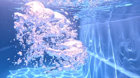 Underwater view of bubbles rising in a swimming pool Video stock 325620316
