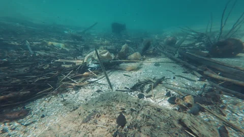Underwater view of the garbage on the sea bed near the island of Ilha Grande in Stock Footage 340643180