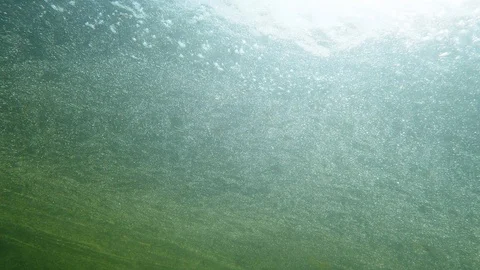 Underwater view of icy slush on the surface of melting lake Stock Footage 115971603
