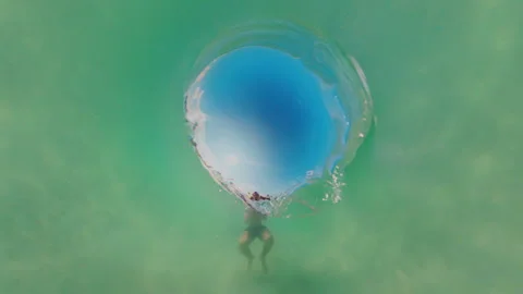 Underwater View Looking Up At Surface Opening With Person Below, Circular Light Stock Footage 333265077