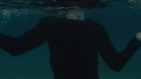 Underwater view of the man drowning Stock Footage 264018735