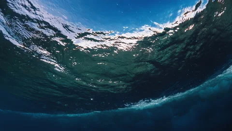 Underwater view of the ocean wave breaking in Maldives with lots of foam and Stock Footage 168690123