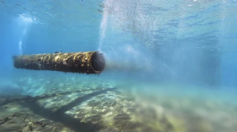 Underwater view of a pipe discharging waste into the sea - 25fps Stock Footage 38041189