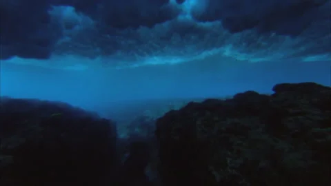 Underwater view of a reef and a wave that breaks Stock Footage 144986635