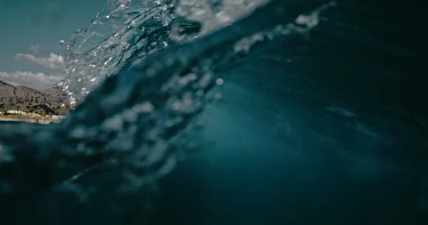 Underwater view of the surf spot with wave breaking over sand bottom. Surfing Video stock 123285288