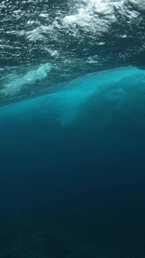 Underwater View of Surf Waves Creating Patterns of Light Stock Footage 335197751