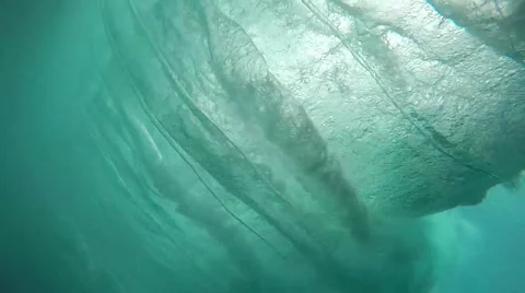 Underwater view of surfing wave breaking over reef Stock Footage 49267000