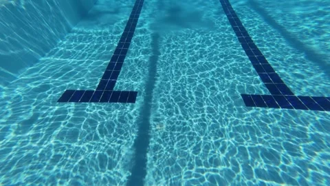 Underwater View of Swimming Pool Floor Markings and Ripples Stock Footage 342015919