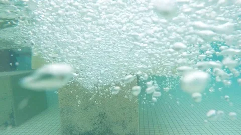 Underwater view in a swimming pool with high current and bubbles Stock Footage 113796741