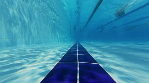 Underwater View of Swimming Pool Lanes with Swimmers Stock-Footage 342014743