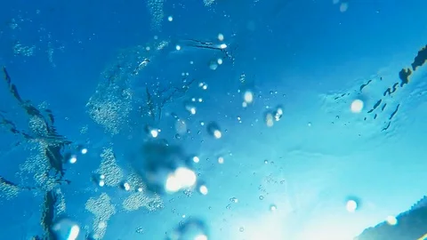 Underwater view to the water surface. Dive deep into the ocean. Vídeo Stock 103947197