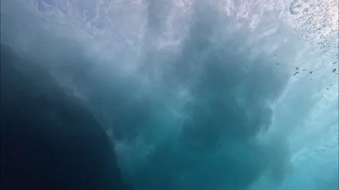 Underwater View of Waves Crashing Against Reef with White Foam Bubbles 4K Stock Footage 342112482