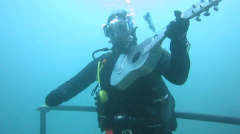 Underwater violin playing | Stock Video | Pond5