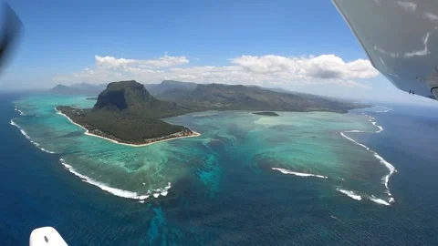 Underwater waterfall illusion view from the plane on the island of Mauritius Stock Footage 318969267