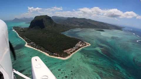 Underwater waterfall illusion view from the plane on the island of Mauritius Stock Footage 318969406