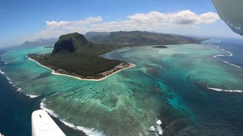 Underwater waterfall illusion view from the plane on the island of Mauritius Stock Footage 318969415