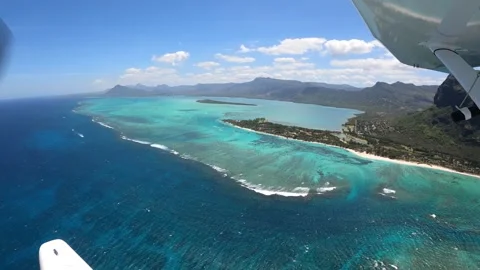 Underwater waterfall illusion view from the plane on the island of Mauritius Stock Footage 318969573