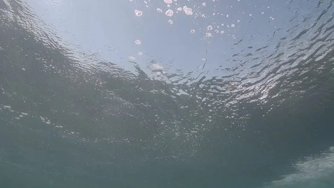 Underwater wave crashes below the surface of the sea in slow motion Stock Footage 117126659