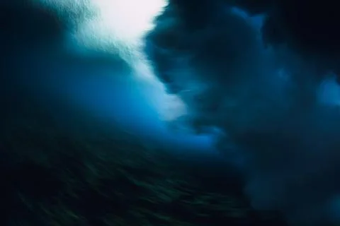 Underwater wave with soft motion blur, deep blue ocean flow and aquatic atm.. Stock Photos