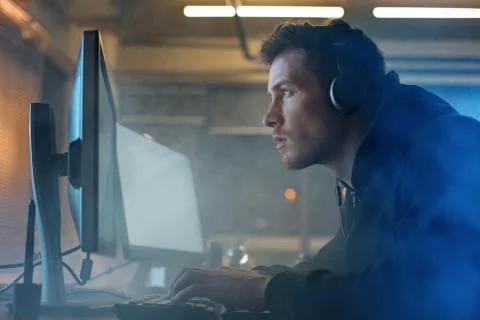 Undistracted programmer noting on computer Stock Photos