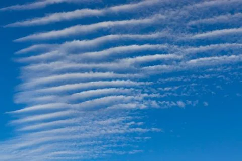 Undulated cloud on a blue sky background Stock Photos