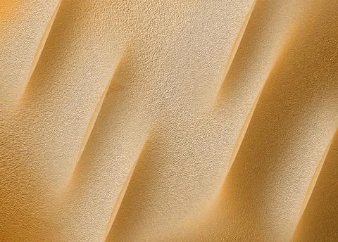 Undulating sand dunes create a rhythmic pattern of light and shadow. The te.. Stock Illustration