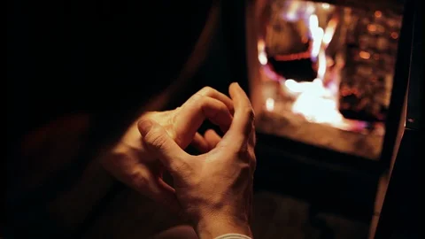 Uneasy man hand fidgeting in front of an open wood oven door 스톡 동영상 118260761
