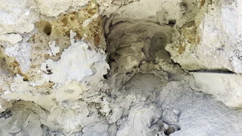 Uneven cracks on cement surface, repaired building exterior wall, hole filled Stock Footage 319383340