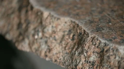 Uneven section of granite raw stone slab, closeup view. Video stock 120806127